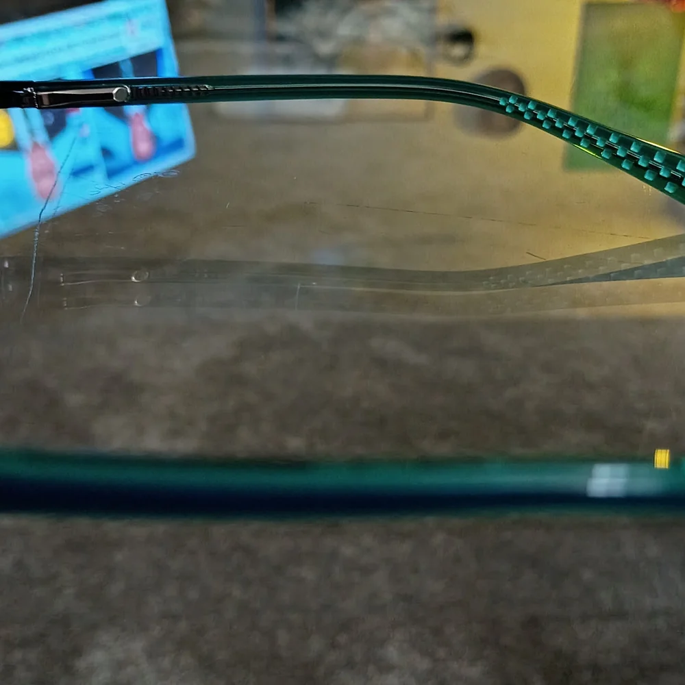Nike Kids Black Frames with Teal Patterned Temples and Red Logo